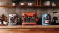 trio of small espresso machines on counter.